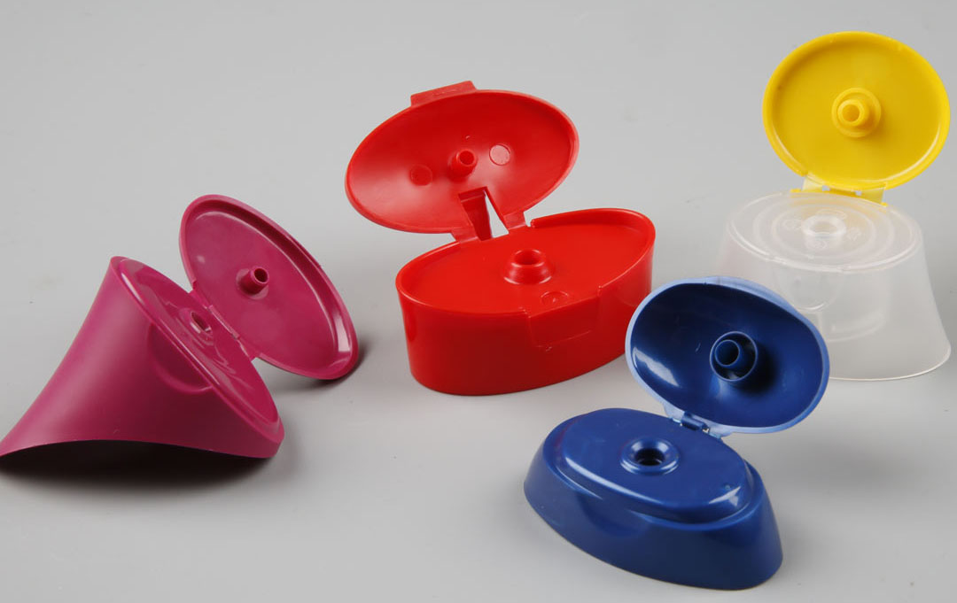 Two color flip top cap molds