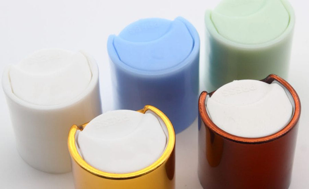 Bottle shampoo caps in two color mold design